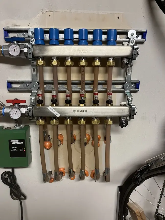 Plumber performing Water Heater Repair at a residential property in Allouez